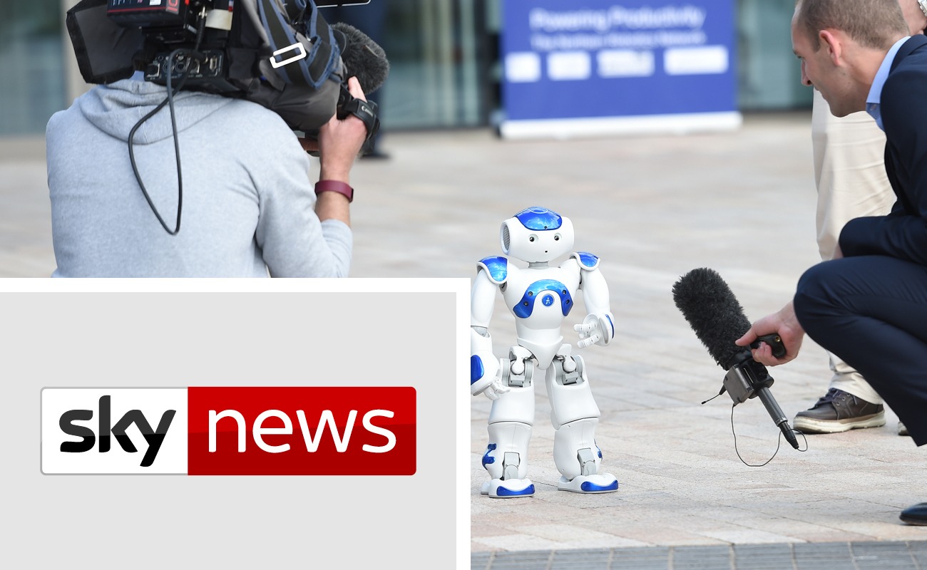 Sky news graphic and Robot with cameraman and presenter